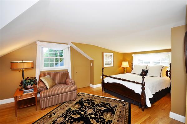 31 MacArthur Road Concord, MA 01742 - Photo 19 of 30 a bedroom with a bed and wooden floor