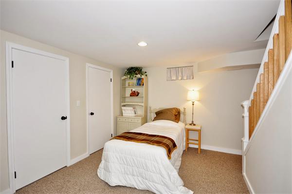 31 MacArthur Road Concord, MA 01742 - Photo 21 of 30 a bedroom with a bed and a window