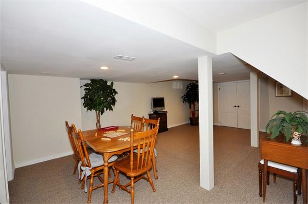 31 MacArthur Road Concord, MA 01742 - Photo 22 of 30 a dining room with furniture and potted plants