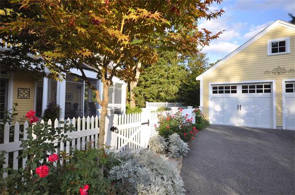 31 MacArthur Road Concord, MA 01742 - Photo 24 of 30 a view of a house with a yard and a garden