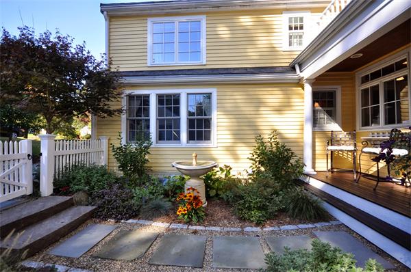 31 MacArthur Road Concord, MA 01742 - Photo 26 of 30 a view of a house with potted plants