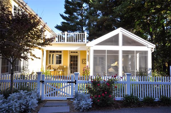 31 MacArthur Road Concord, MA 01742 - Photo 29 of 30 a front view of a house with a garden