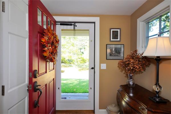 31 MacArthur Road Concord, MA 01742 - Photo 3 of 30 a vase of flowers sitting next to a window