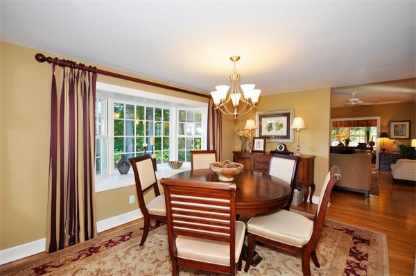 31 MacArthur Road Concord, MA 01742 - Photo 6 of 30 a view of a dining room with furniture a chandelier and wooden floor