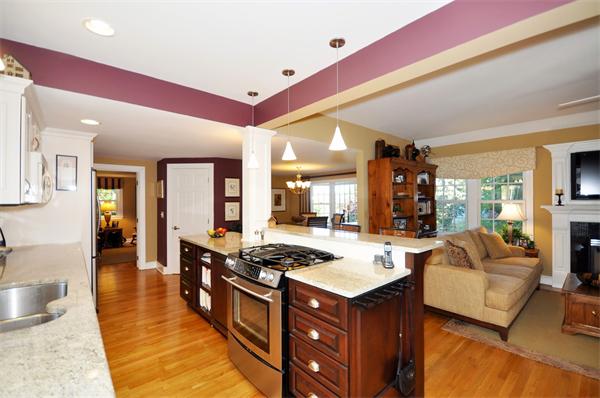 31 MacArthur Road Concord, MA 01742 - Photo 7 of 30 a large living room with stainless steel appliances furniture stove and a kitchen view