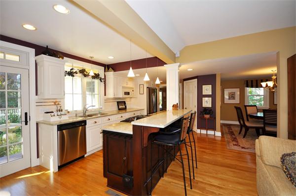 31 MacArthur Road Concord, MA 01742 - Photo 9 of 30 a kitchen with lots of counter top space and painting on the wall