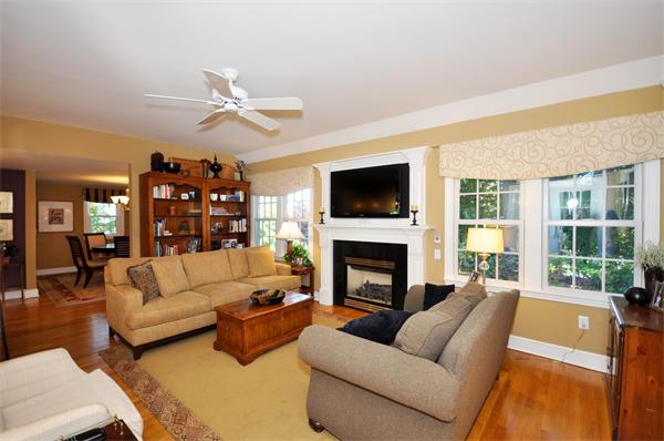 31 MacArthur Road Concord, MA 01742 - Photo 10 of 30 a living room with furniture fireplace and a flat screen tv