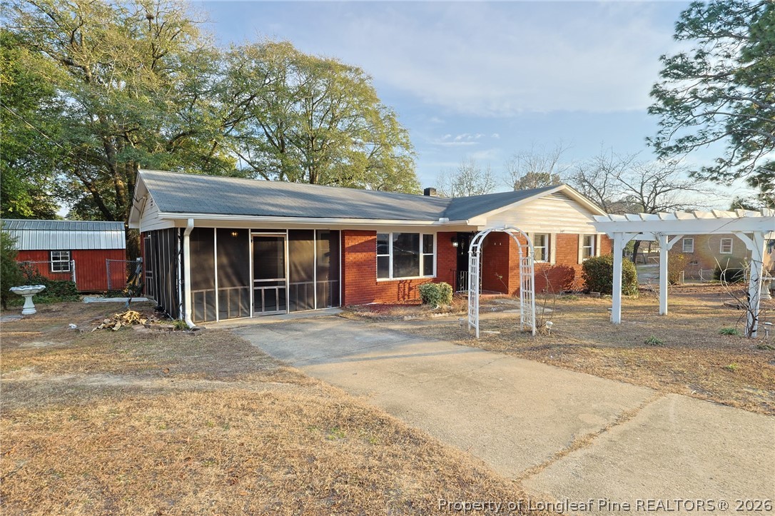 3315 Nato Road Fayetteville, NC 28306 - Photo 1 of 28 a front view of a house with a garden