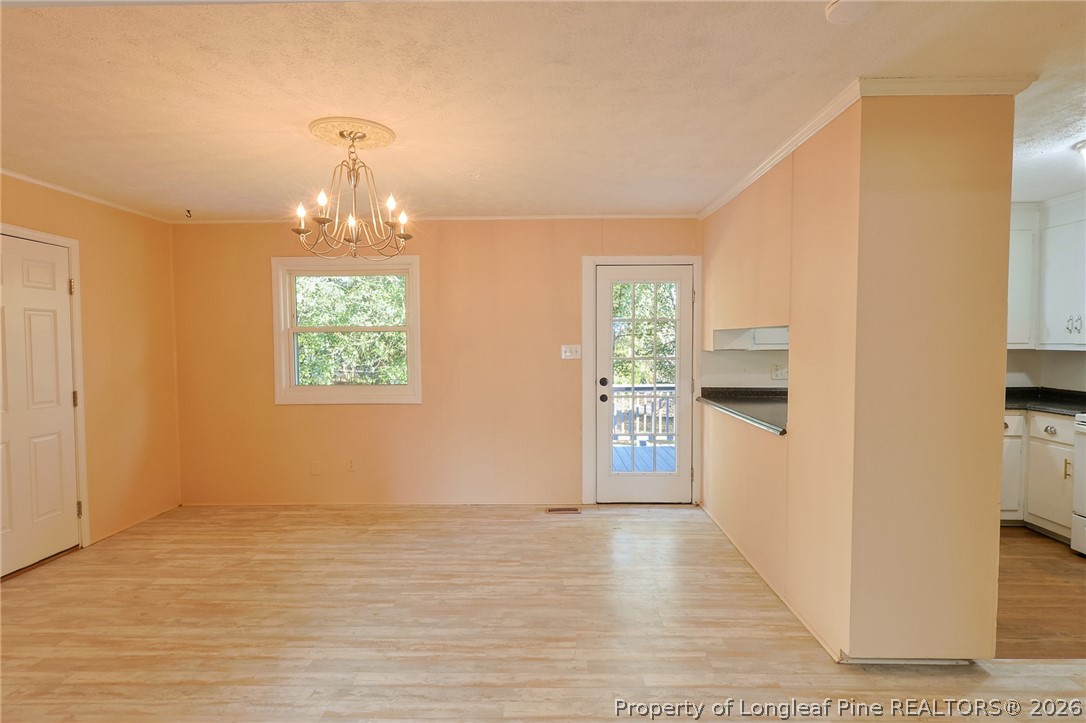 3315 Nato Road Fayetteville, NC 28306 - Photo 11 of 28 a view of a kitchen with furniture and an empty room