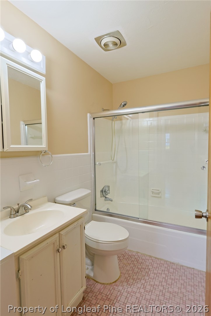 3315 Nato Road Fayetteville, NC 28306 - Photo 16 of 28 a bathroom with a sink a toilet and shower