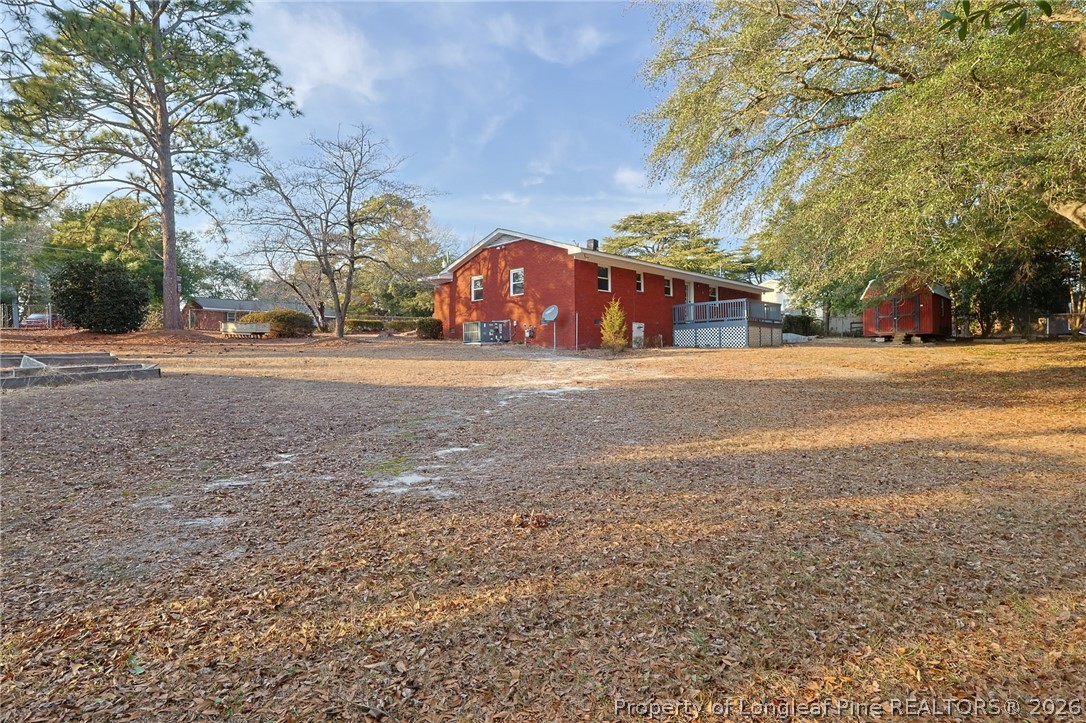3315 Nato Road Fayetteville, NC 28306 - Photo 27 of 28 a front view of a house with a yard and garage
