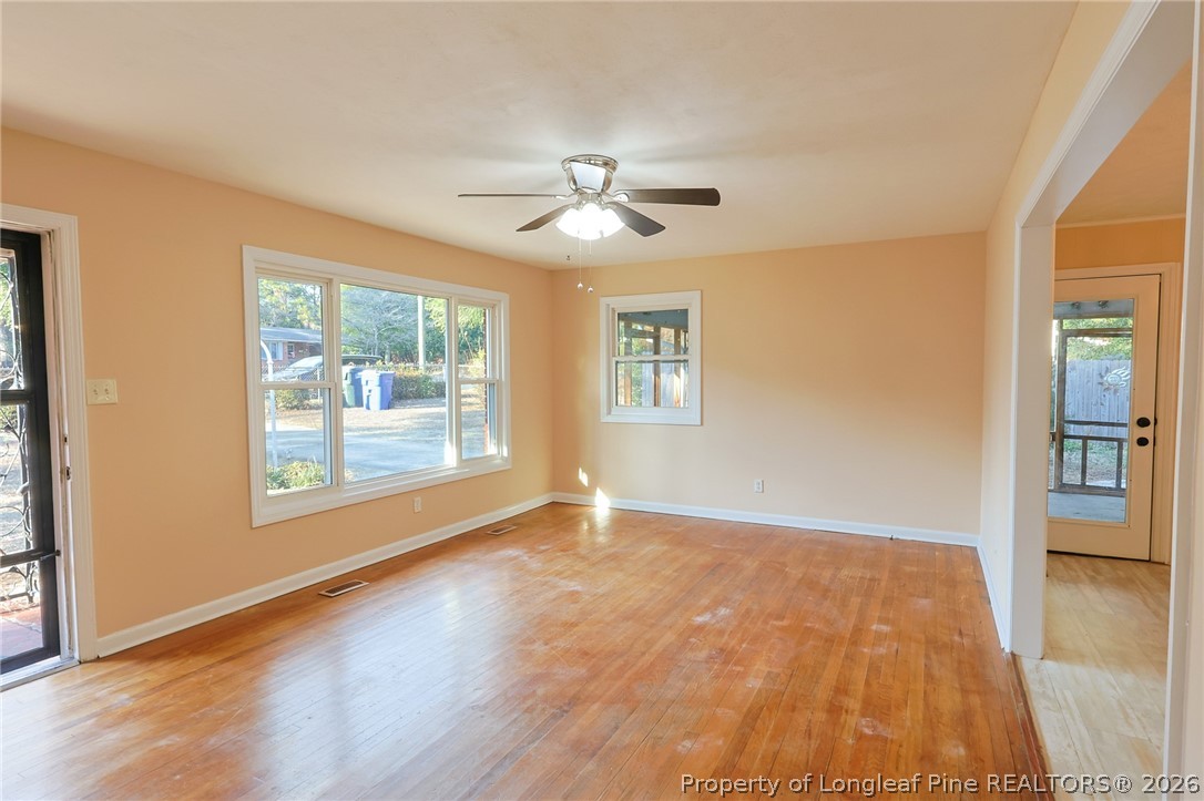 3315 Nato Road Fayetteville, NC 28306 - Photo 6 of 28 a view of empty room with wooden floor and fan