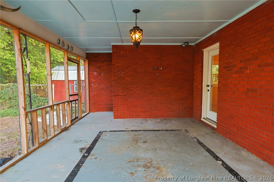 3315 Nato Road Fayetteville, NC 28306 - Photo 10 of 28 a view of empty room with floor to ceiling window and carpet