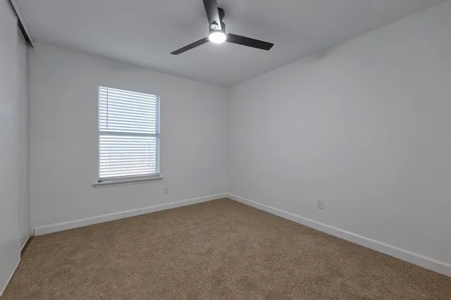 an empty room with a empty space and a window