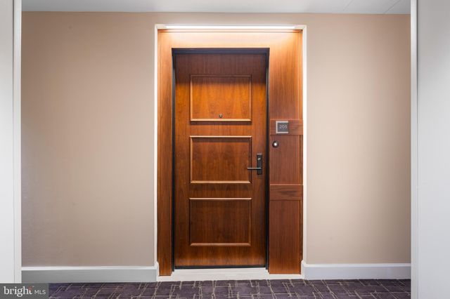 a bedroom with a bed and a desk