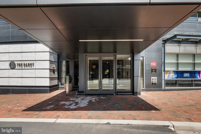 a bedroom with a bed and a chair