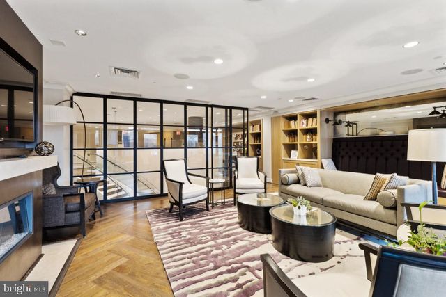 a living room with furniture and a rug