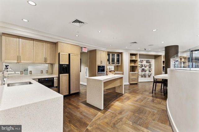 a view of a patio with a dining table and chairs