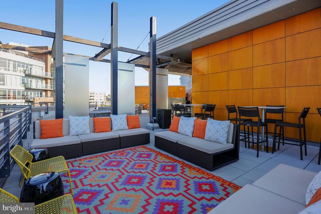 a view of a building with a fountain and a fire pit