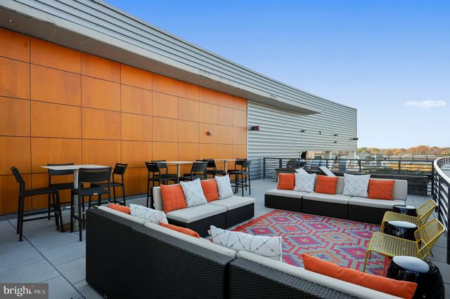 a clock on a pole on a street