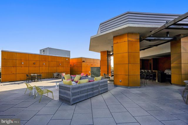 a view of a building with sitting area