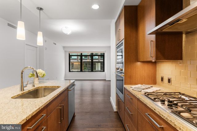 a view of a living room filled with furniture