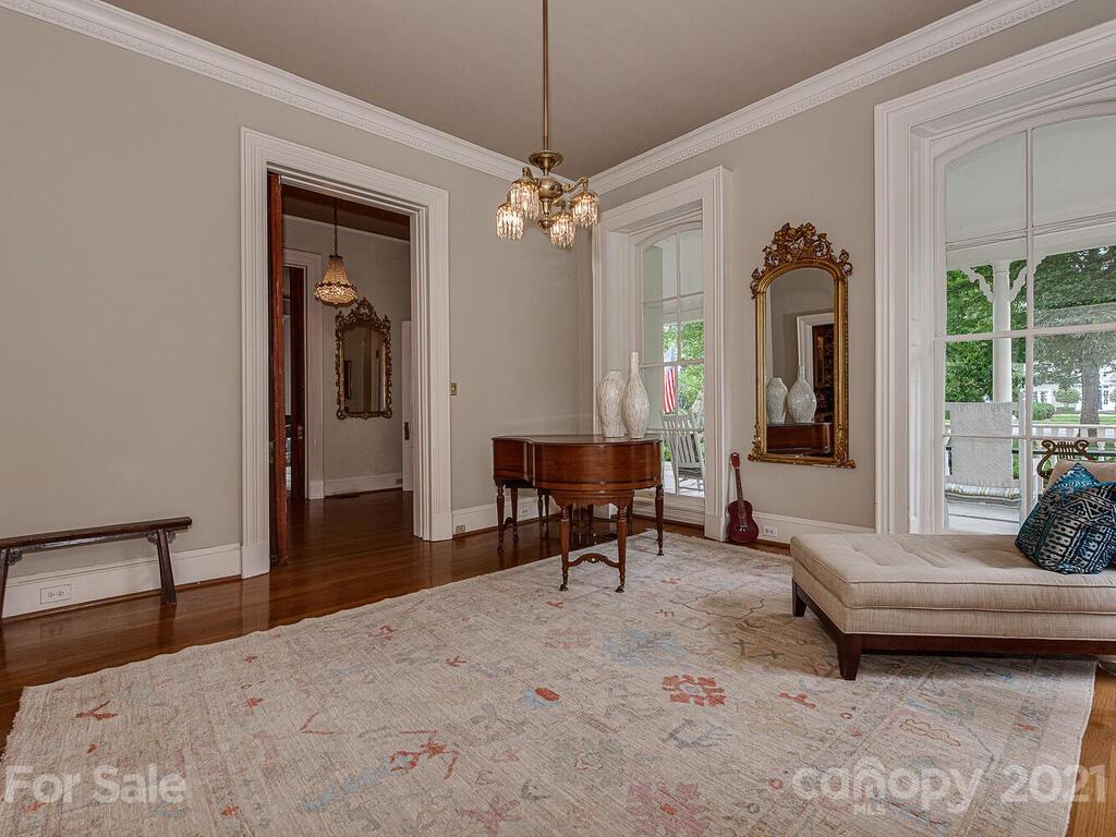1700 Queens Road Charlotte, NC 28207 - Photo 19 of 48 a living room with furniture a window and a chandelier