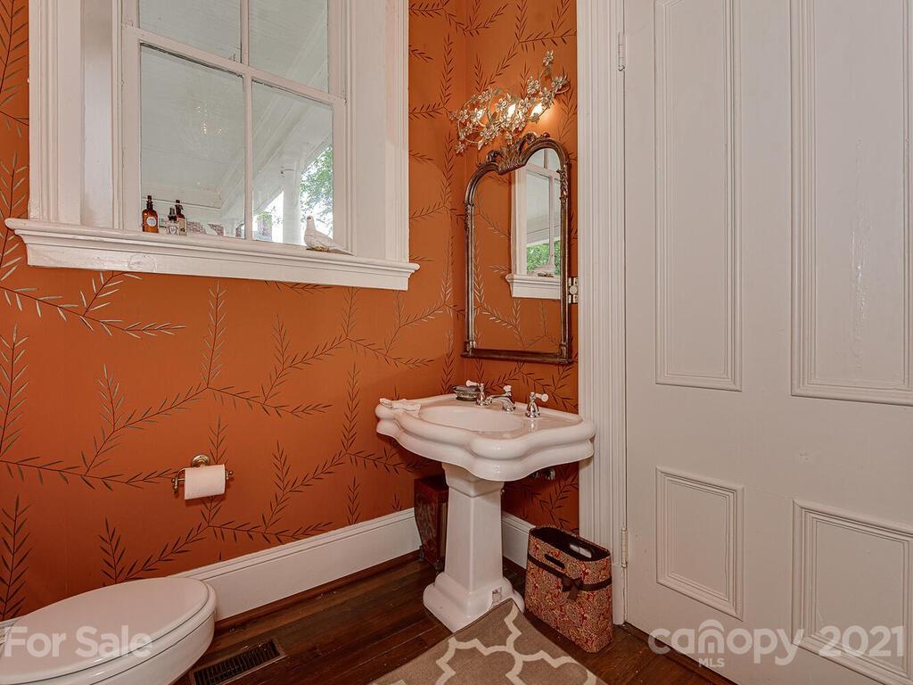 1700 Queens Road Charlotte, NC 28207 - Photo 20 of 48 a bathroom with a sink a mirror and a toilet