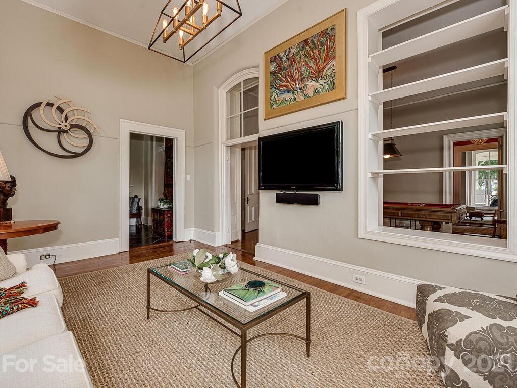1700 Queens Road Charlotte, NC 28207 - Photo 23 of 48 a living room with furniture and a flat screen tv
