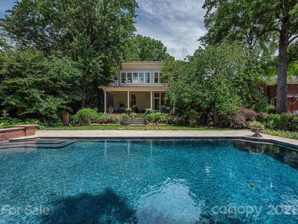 1700 Queens Road Charlotte, NC 28207 - Photo 44 of 48 a front view of a house with swimming pool and a yard