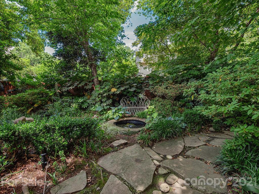 1700 Queens Road Charlotte, NC 28207 - Photo 47 of 48 a backyard of a house with a yard and outdoor seating