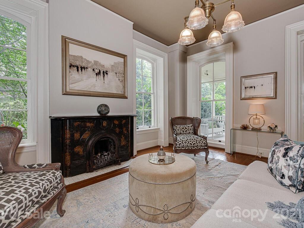 1700 Queens Road Charlotte, NC 28207 - Photo 6 of 48 a living room with furniture and a fireplace
