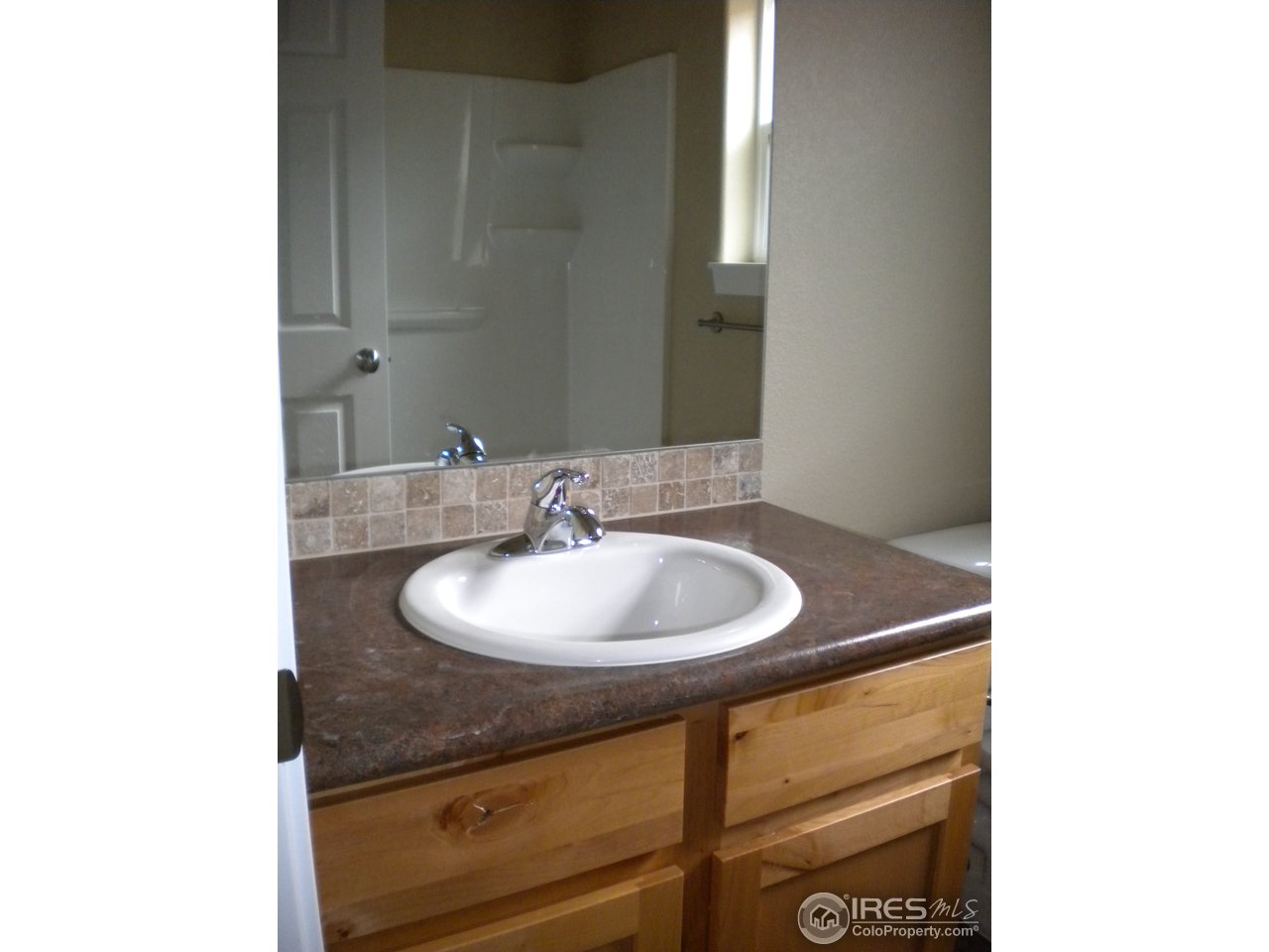 1908 Corvid Way Fort Collins, CO 80521 - Photo 12 of 25 main bath with tile backsplash