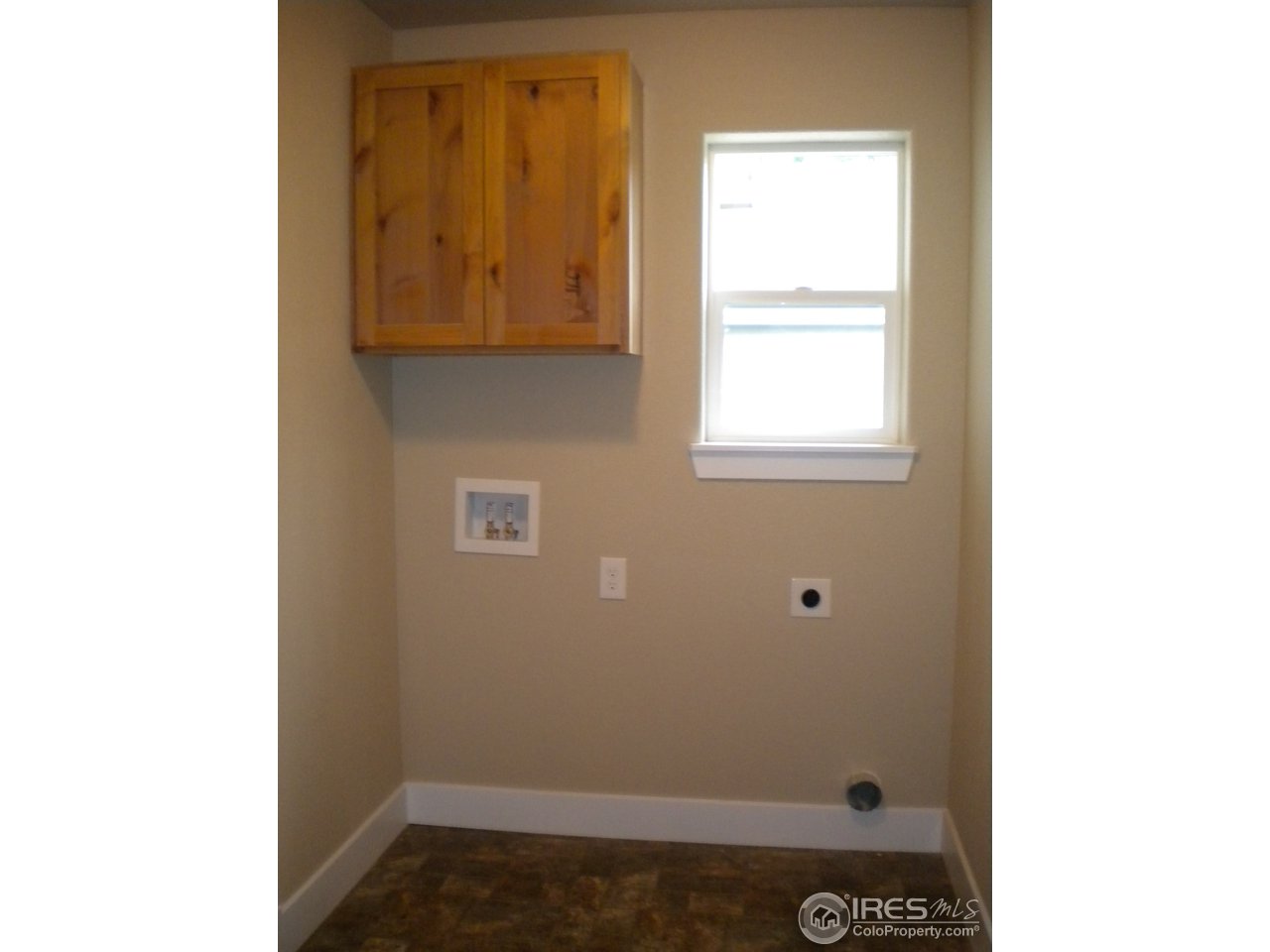 1908 Corvid Way Fort Collins, CO 80521 - Photo 22 of 25 laundry room right off kitchen