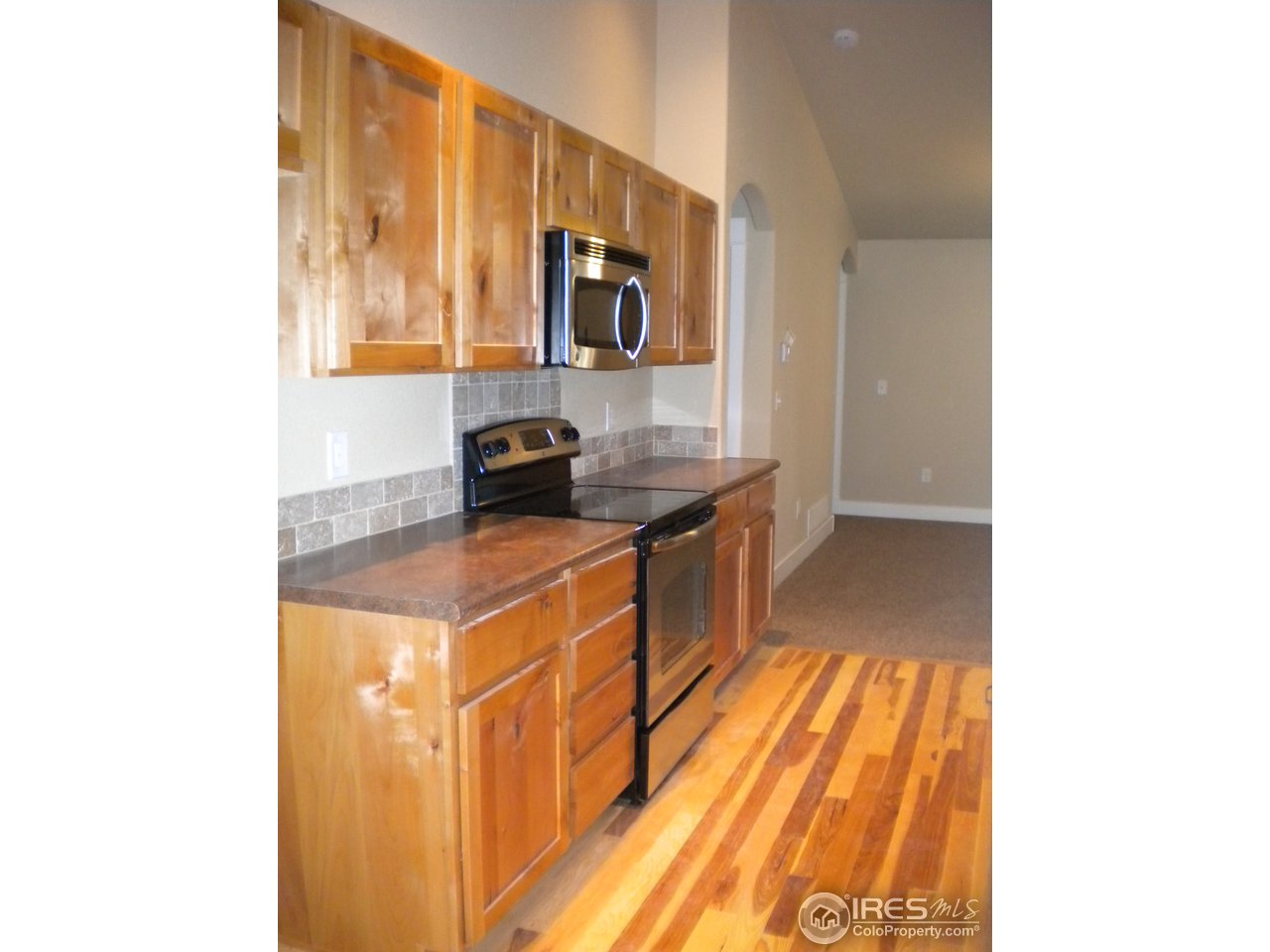 1908 Corvid Way Fort Collins, CO 80521 - Photo 7 of 25 plenty of beautiful cabinets and counter space