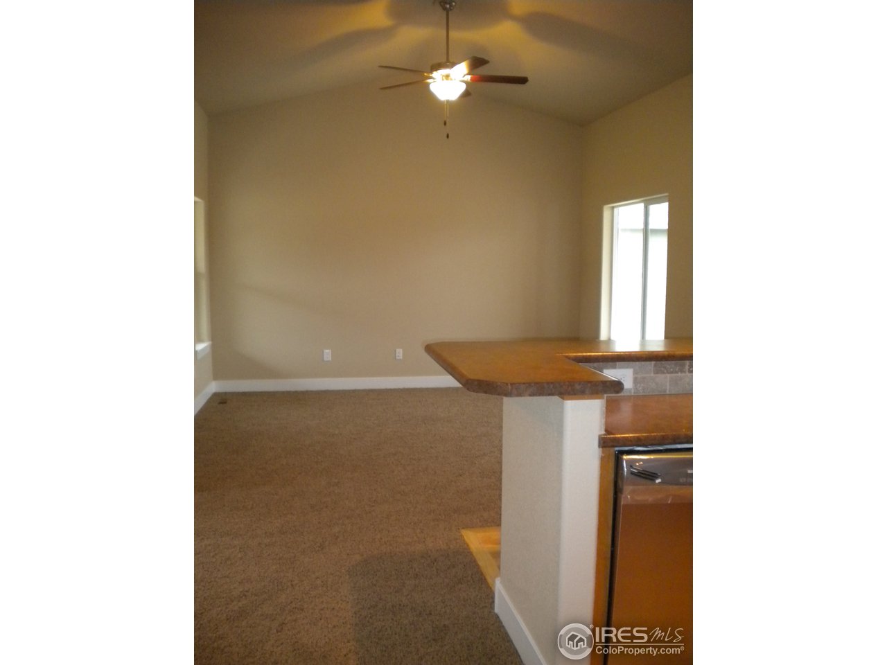 1908 Corvid Way Fort Collins, CO 80521 - Photo 9 of 25 vaulted great room with ceiling fan