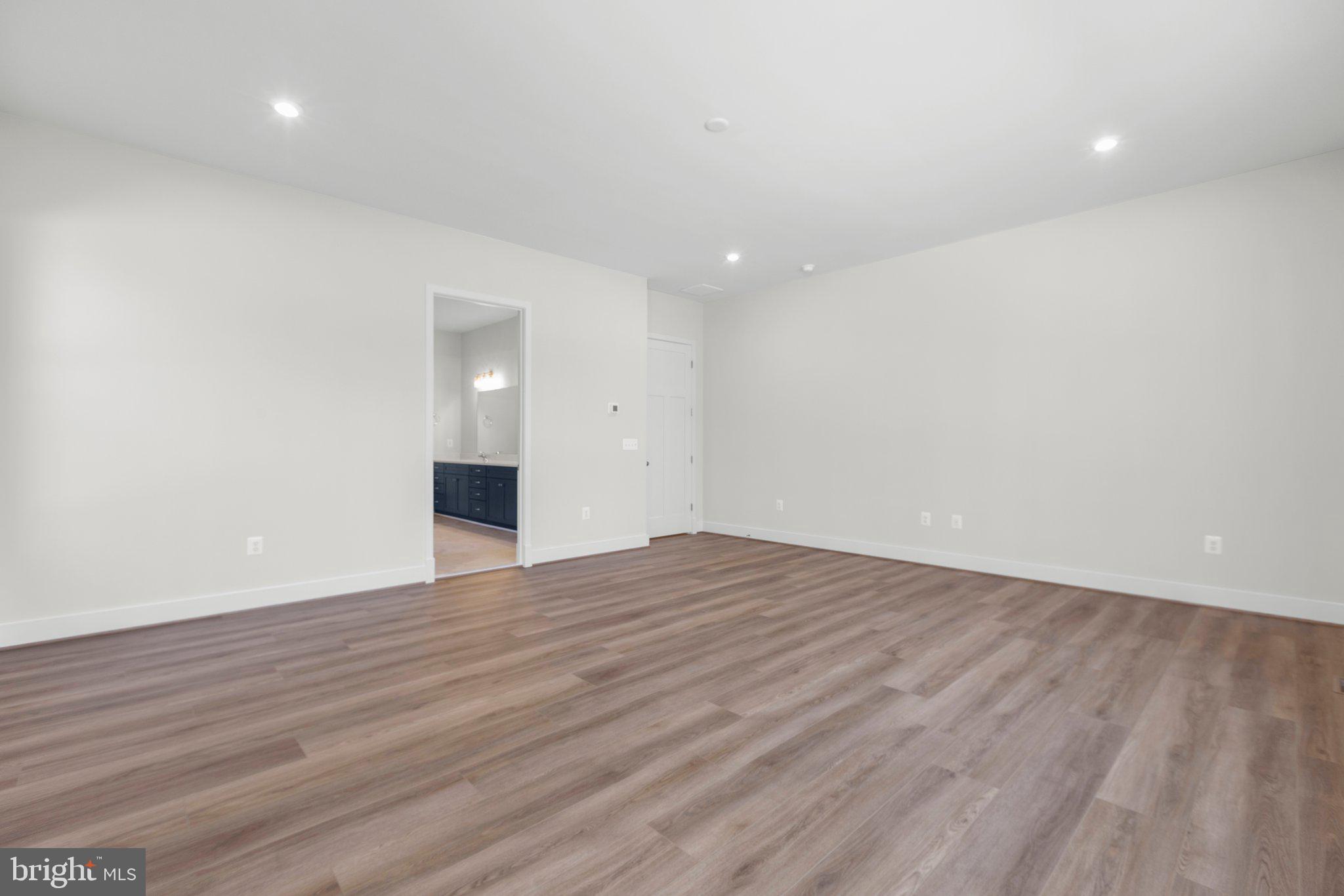 10 Burwell Road Nokesville, VA 20181 - Photo 29 of 57 a view of an empty room with wooden floor and a window