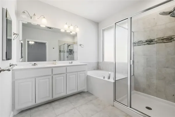 a bathroom with a shower and a sink