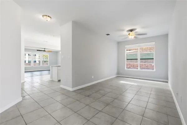 an empty room with windows and entrance