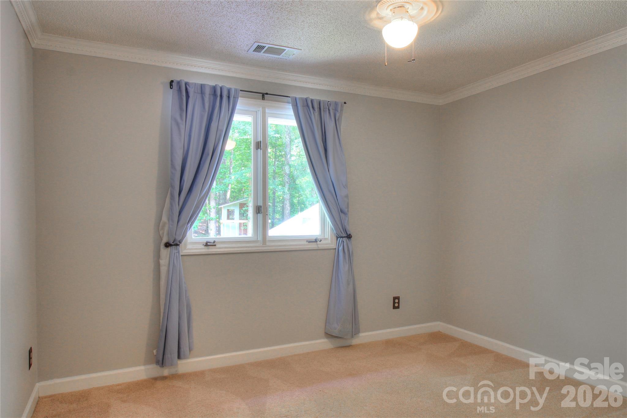 3408 Providence Manor Road Charlotte, NC 28270 - Photo 31 of 39 an empty room with a window