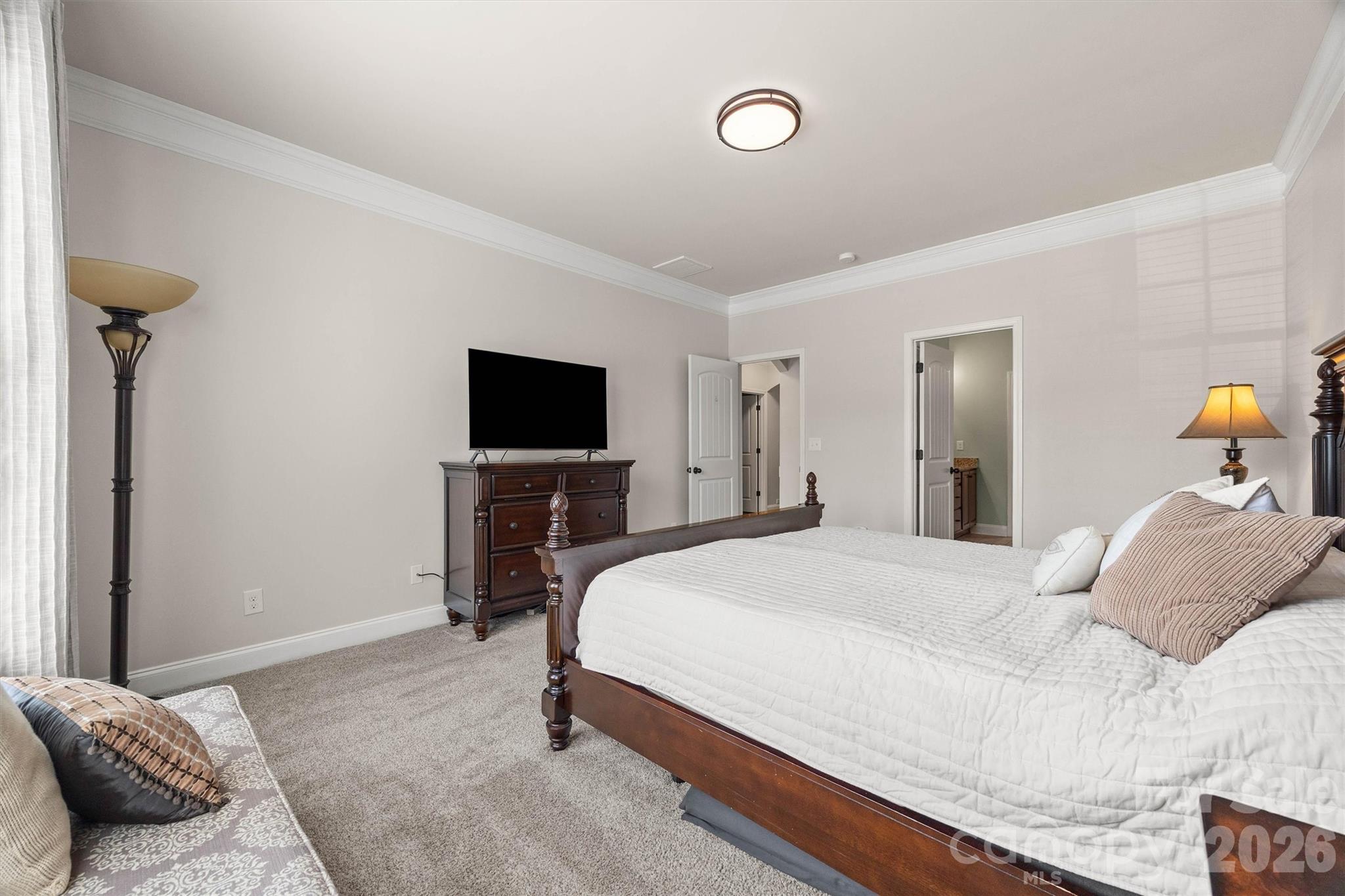 299 Annatto Way Tega Cay, SC 29708 - Photo 23 of 46 a bedroom with a bed and a flat screen tv