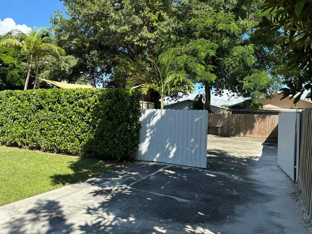 a view of a livingroom with furniture and an empty room