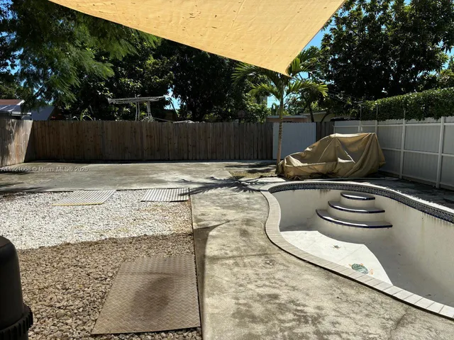 a view of an empty room with windows