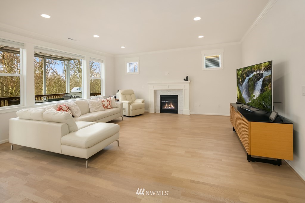 839 Lyons Avenue Northeast Renton, WA 98059 - Photo 8 of 39 a living room with furniture and a fireplace