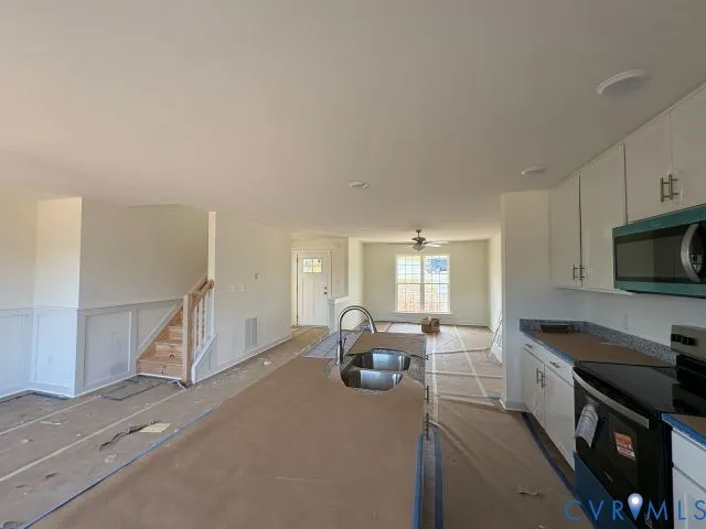 a large kitchen with a large window