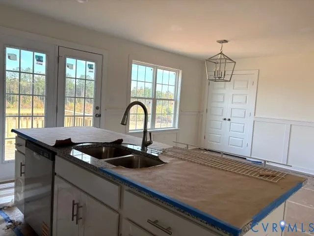 a kitchen with a sink and large window