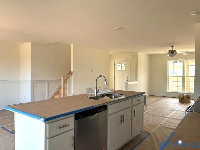 a kitchen with a sink and cabinets