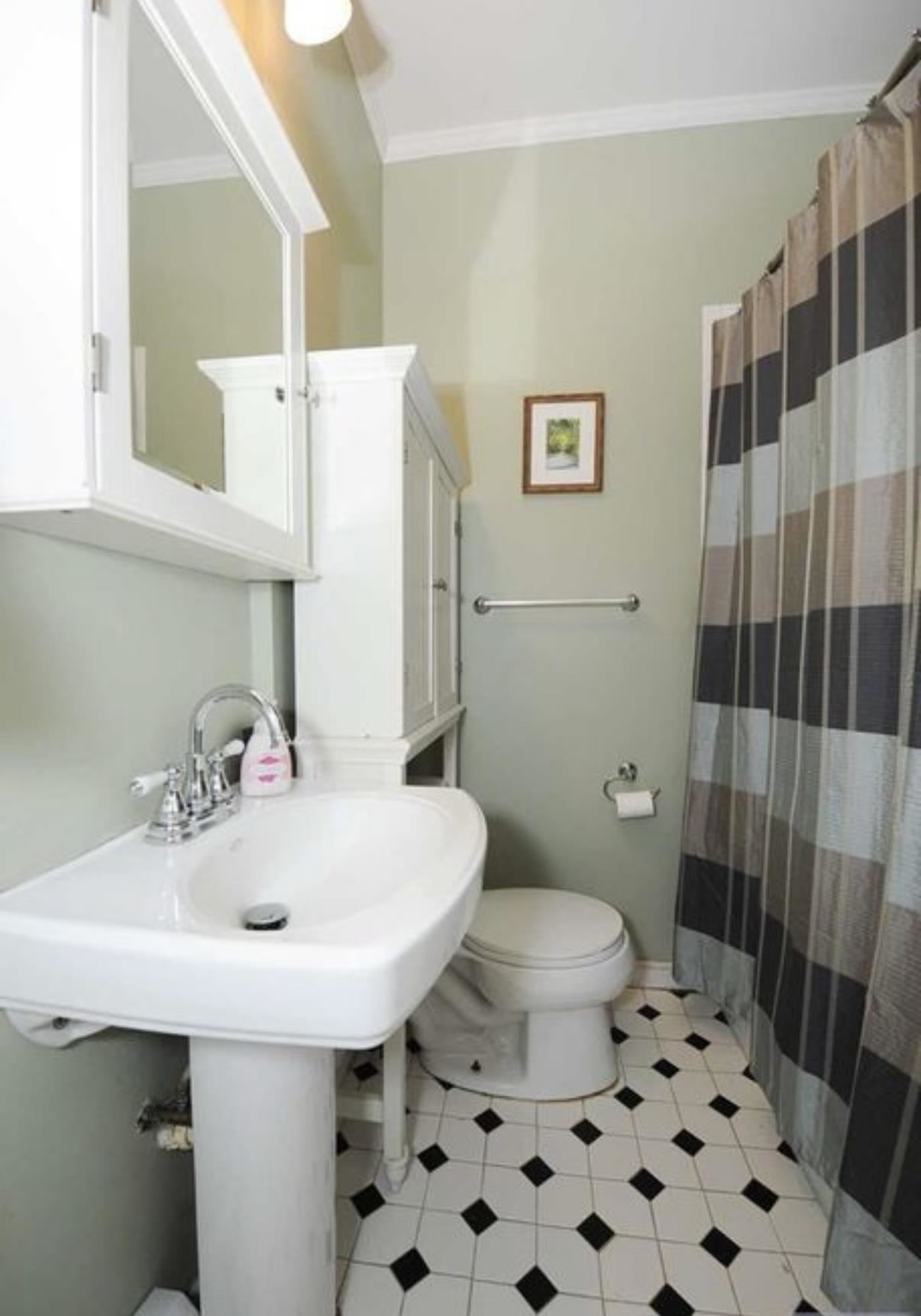 211 14th Street, Unit 2R Hoboken, NJ 07030 - Photo 7 of 10 a bathroom with a sink a toilet and shower