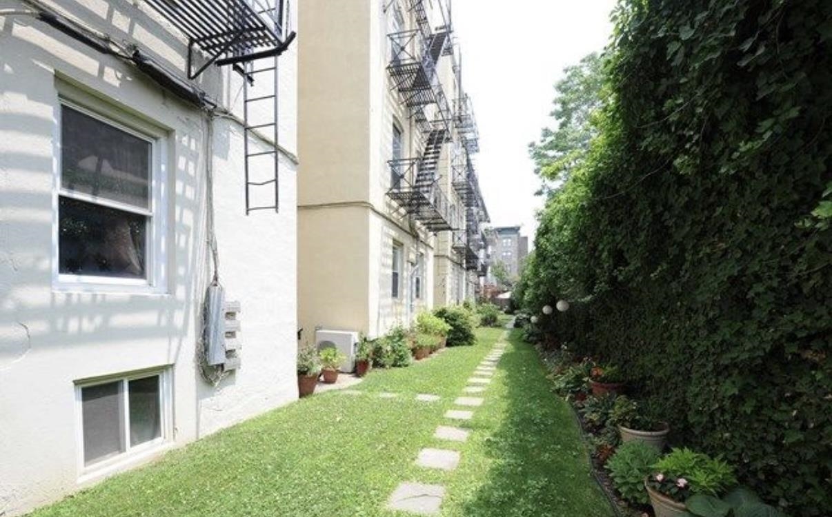 211 14th Street, Unit 2R Hoboken, NJ 07030 - Photo 9 of 10 a view of backyard of house with green space