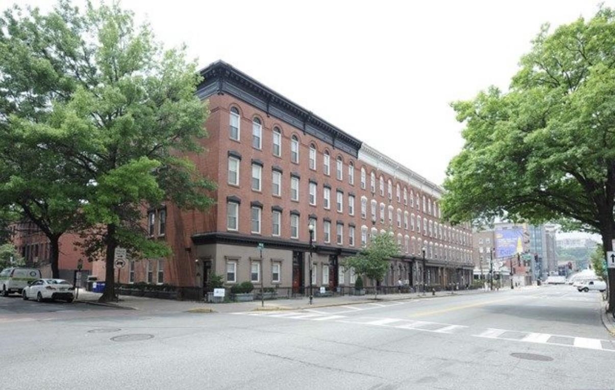 211 14th Street, Unit 2R Hoboken, NJ 07030 - Photo 10 of 10 a city street lined with buildings and cars